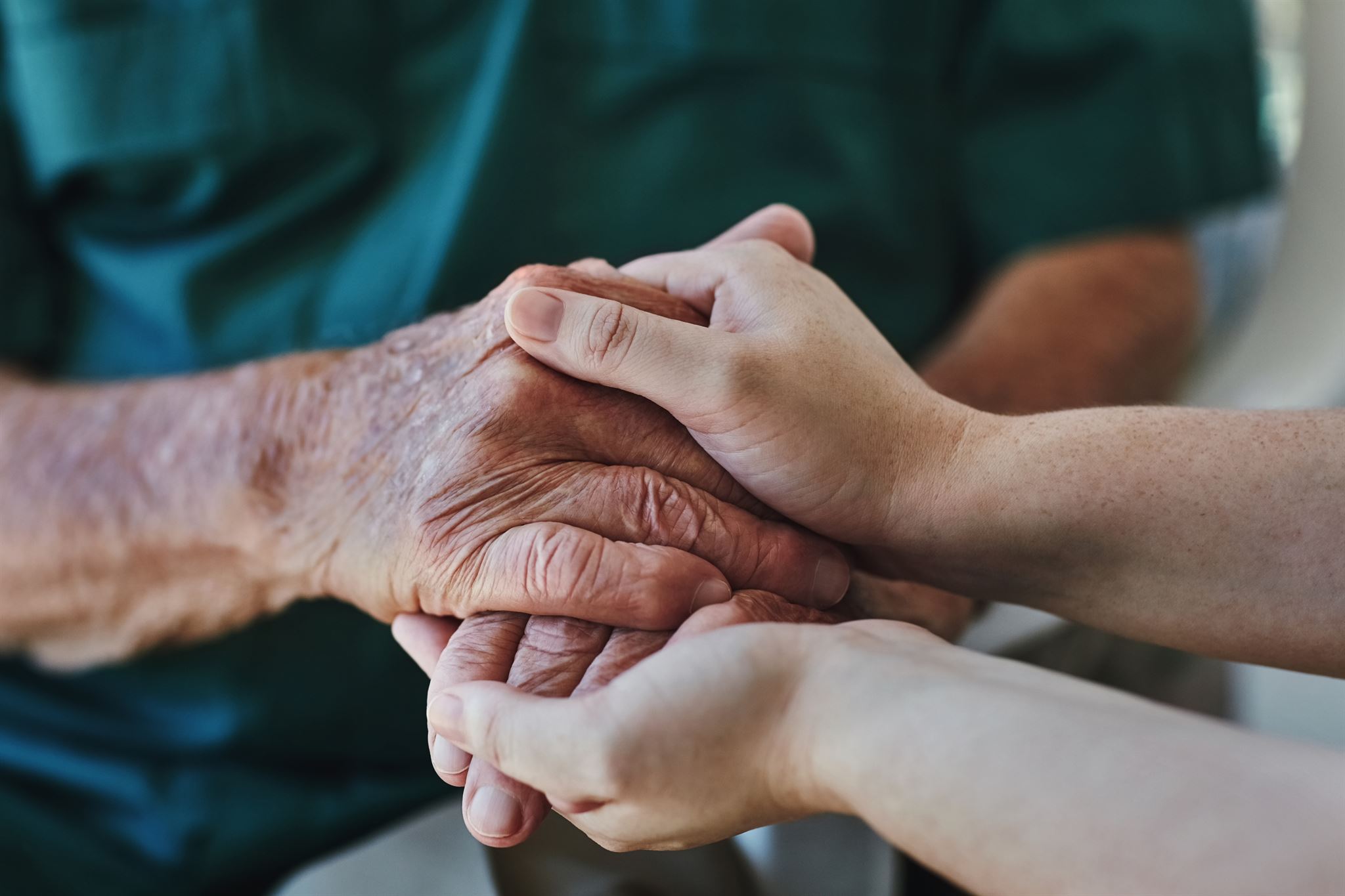 Two-people-holding-each-others-hands